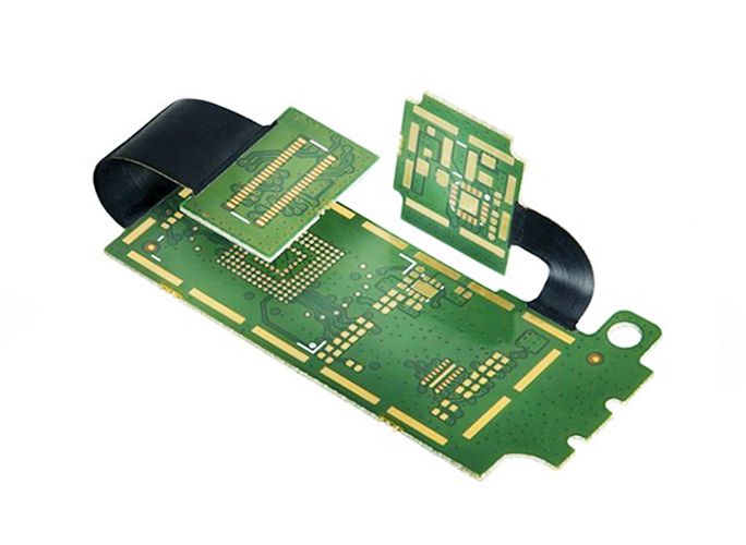 Octagonal black circuit board with a cut-out centre and castellated edges.