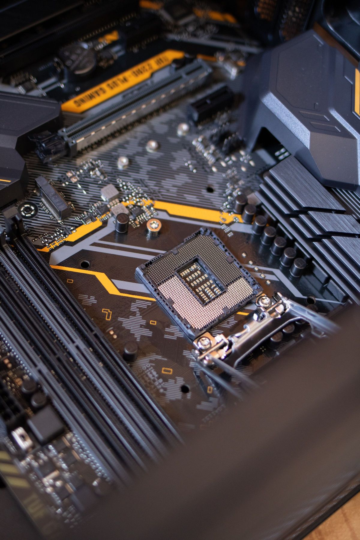 Portrait photograph of circuit boards and electronics on a work surface.